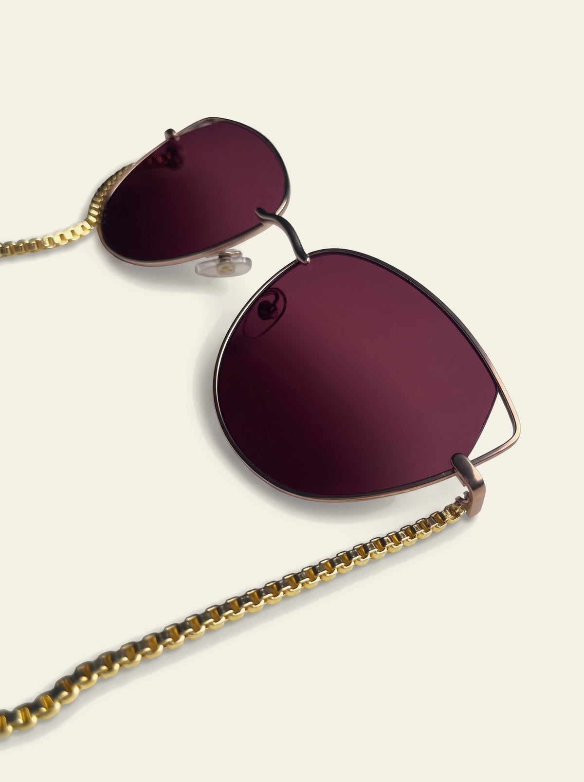 The Taormina - close-up of the two raw purple quartz stones hand-set in gold-dipped caps on the 18K gold-plated box chain
