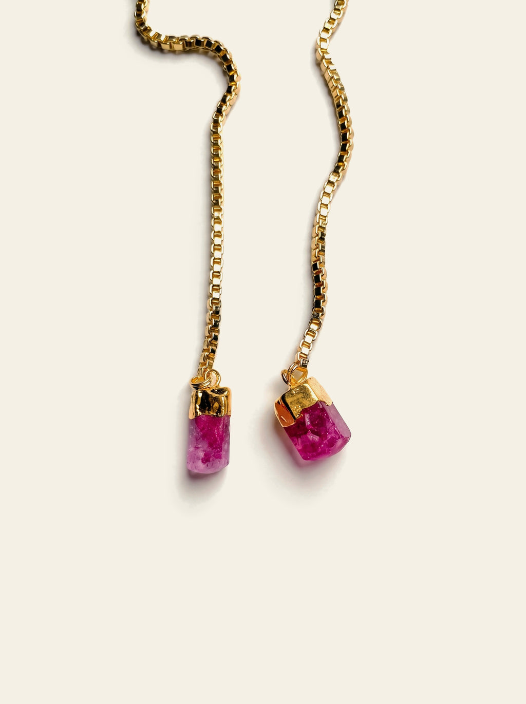 The Sanremo - close-up of two raw pink quartz stones hand-set in gold-plated caps on 18K gold-plated box chains
