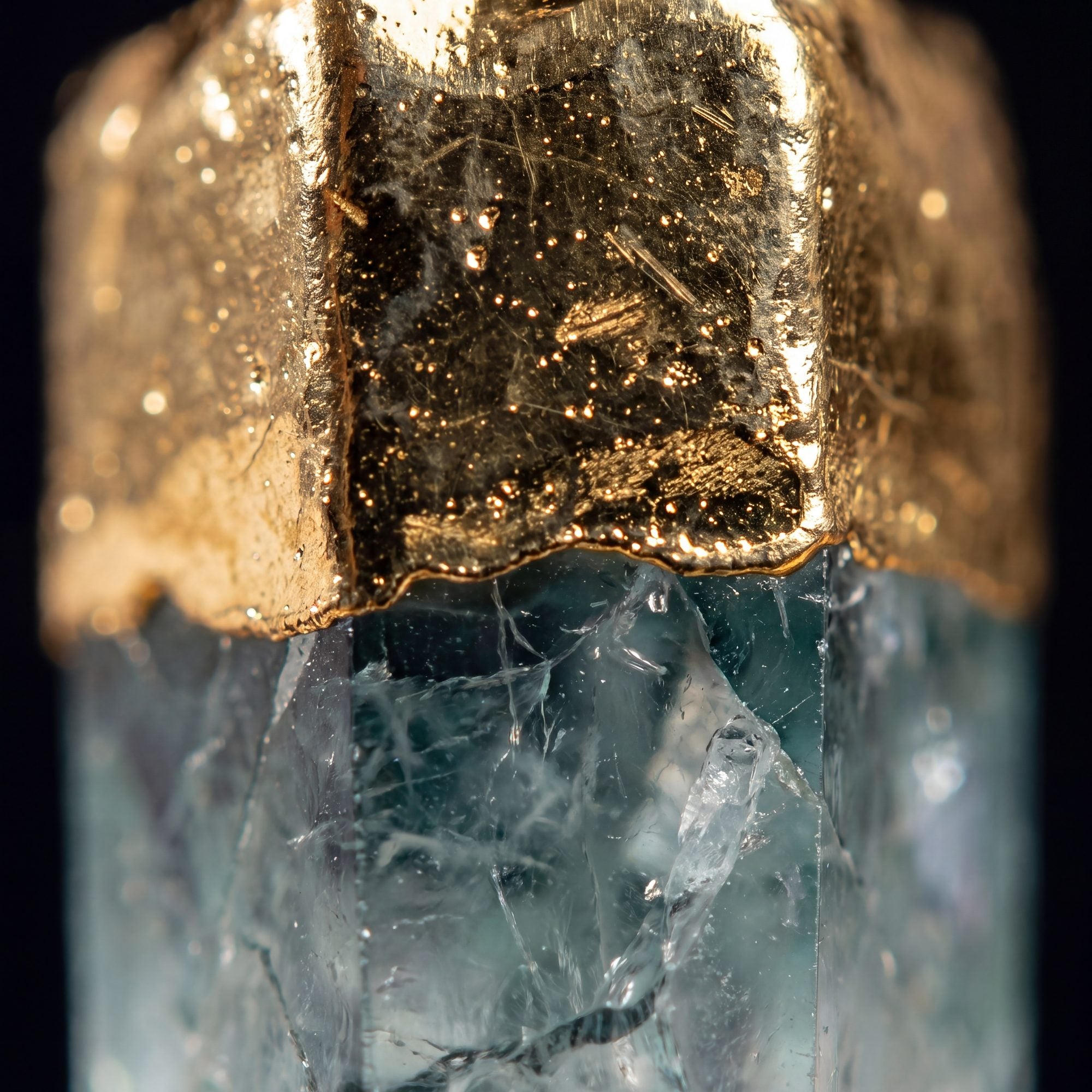 Extreme macro of the gold plating meeting the natural stone